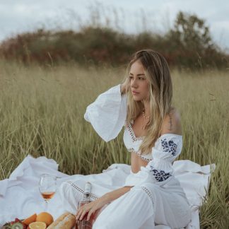 Woman in an embroidered white cotton co-ord