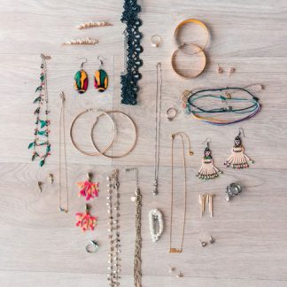 Flat lay of bangles, necklaces and earrings